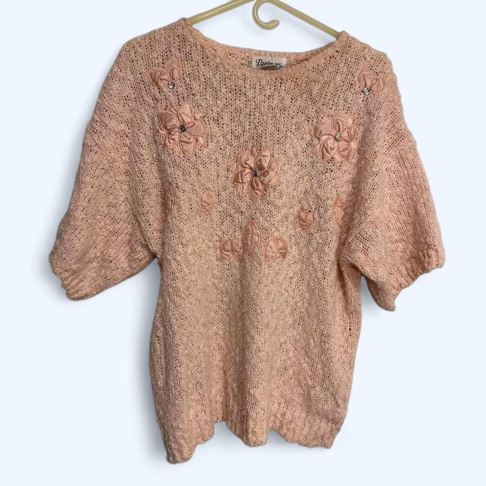 Pink floral sweater with beaded appliqués